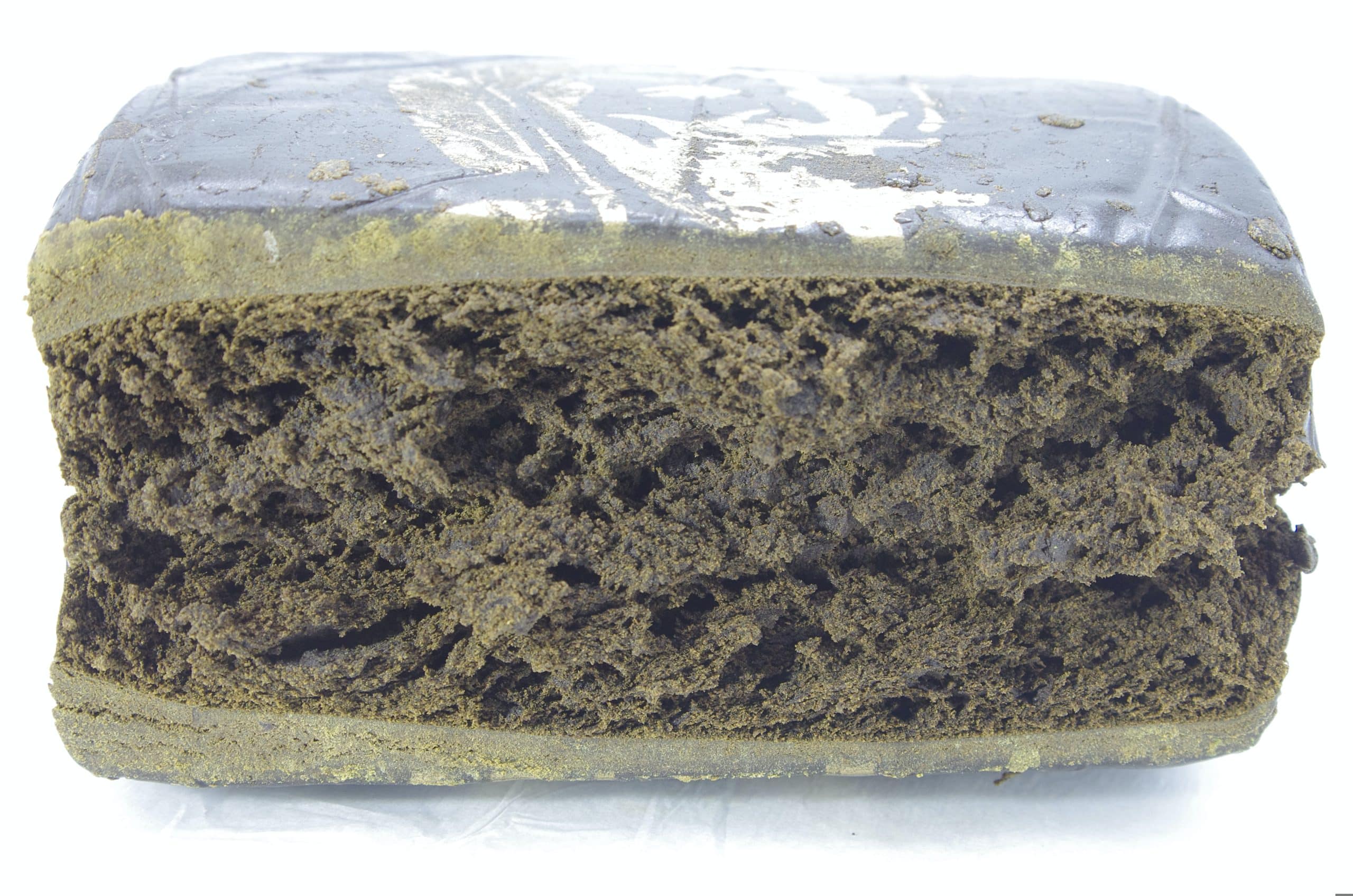 Zig Zag Hash Rectangular compressed block with a layered interior and textured surface, photographed on a plain background.
