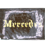 Two rectangular stacked pieces of light brown compressed material with a layered texture photographed on a plain background.
