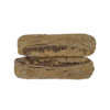 Two rectangular pieces of brown compressed material stacked horizontally, showing a cut edge with layered texture on a plain background.