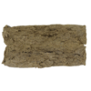 Rectangular piece of compressed brown material with an uneven surface and slightly rough texture photographed on a plain background.